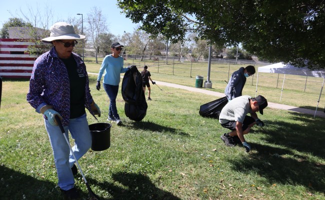 Community members participate in an Earth Day Clean Up