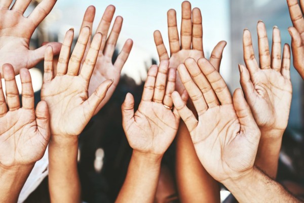 Hands raised together