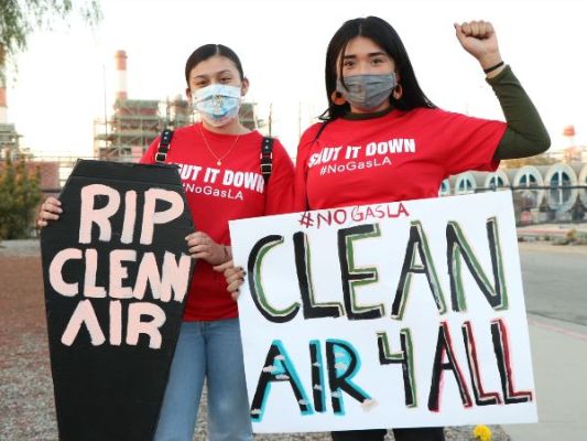 Protestors with signs - "RIP Clean Air" and "Clean Air 4 All"