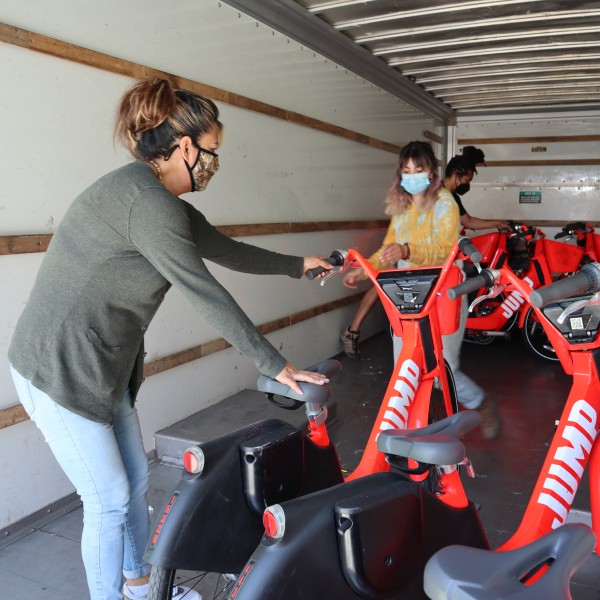 Maria helping to unload electro-bici