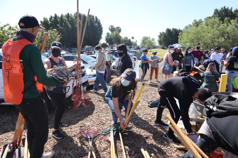 Community members participate in an Earth Day Clean Up