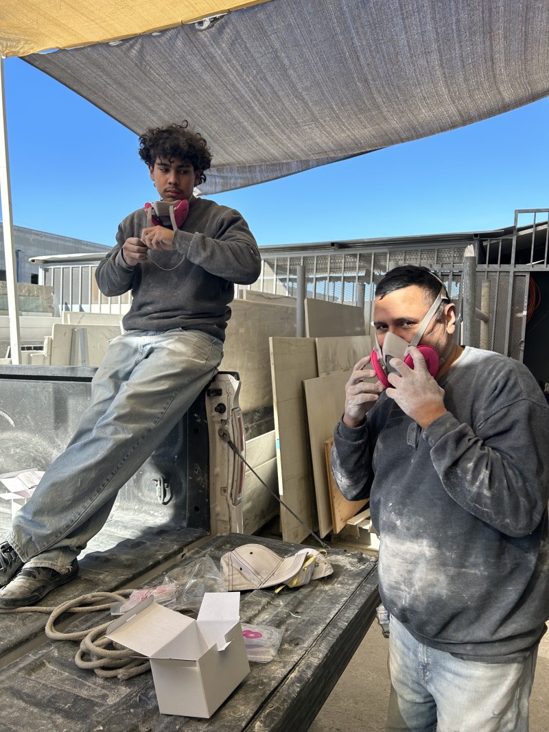 Granite Countertop Workers receiving respirator masks