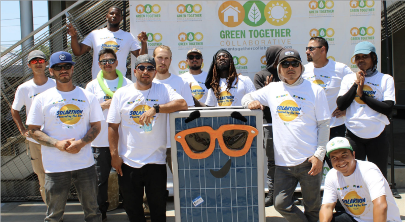 Workers with solar installer GRID Alternatives pose with Pacoima Beautiful and other community members at the First Annual Solarthon at Pacoima City Hall in June 2022. 